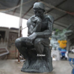 Man Sitting Thinking Statue