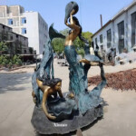 large outdoor mermaid statues