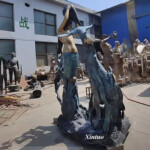 large outdoor mermaid statues