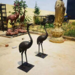 bronze cranes garden statues